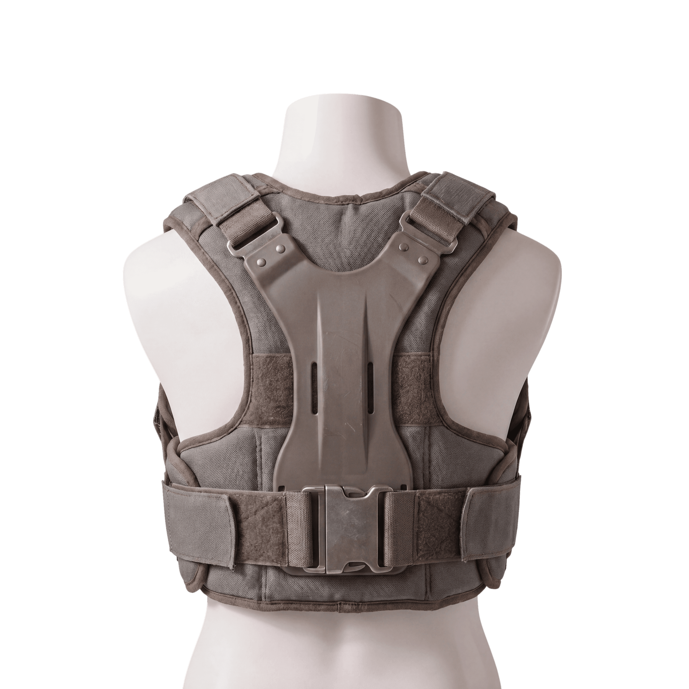 A bulky tactical-style posture harness shown on a light mannequin. Rigid back plate, heavy webbing straps, large central buckle.